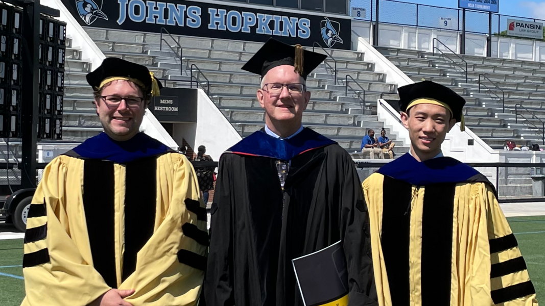 Newly minted PhDs Drs. Blake Dewey and Yufan He flank Prof. J.L. Prince.